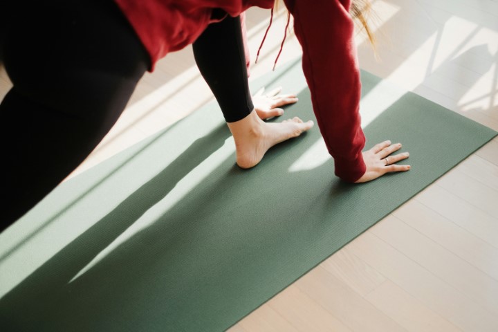 Reformer Pilates class in warm light